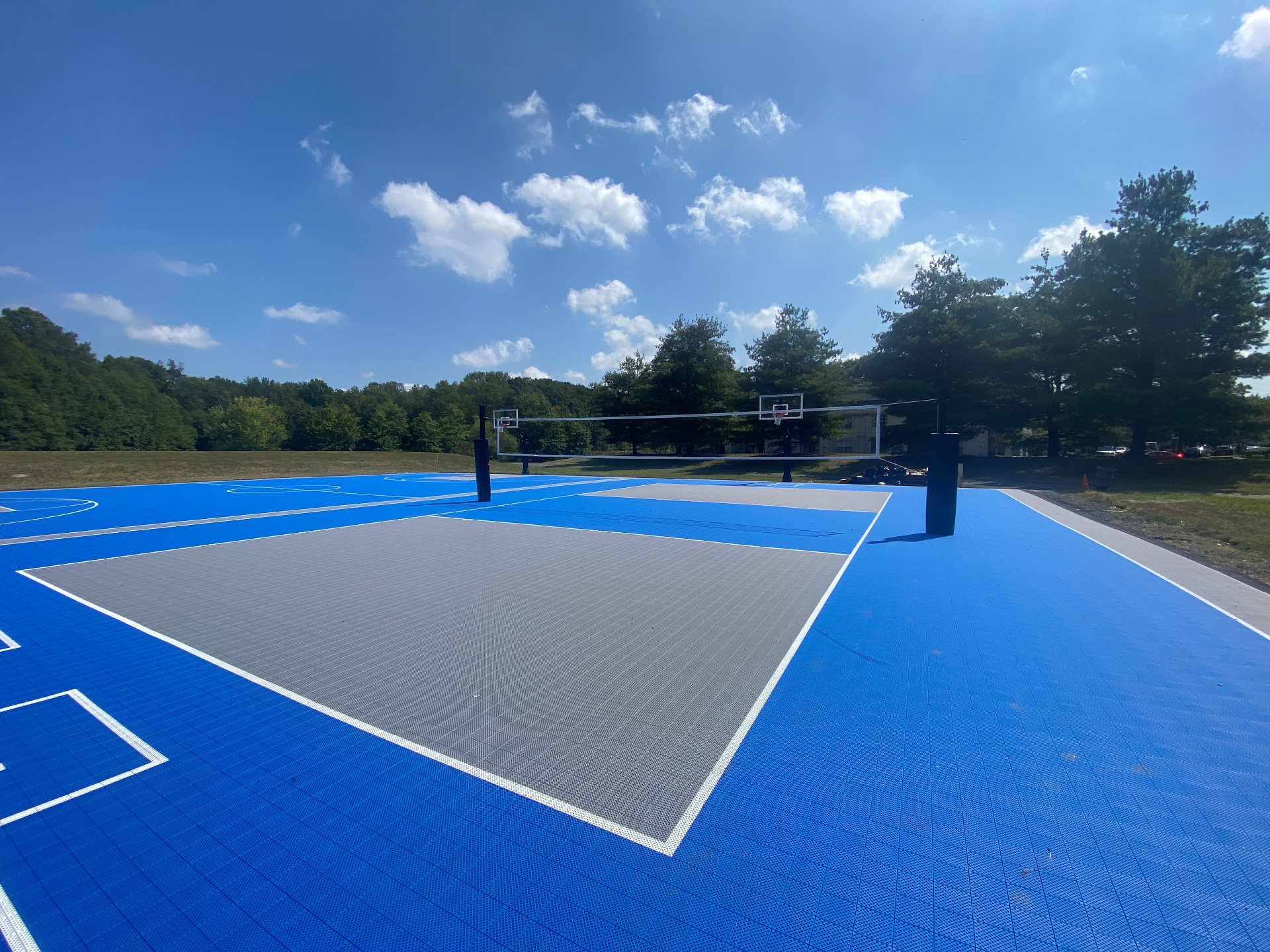 Professional backyard basketball court with modular sport tiles